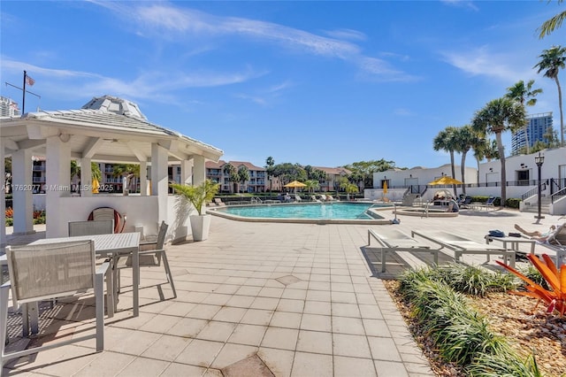 300 Three Islands Blvd Unit 518, Hallandale Beach, FL 33009 - community pool featuring a gazebo, a patio area, and a residential view