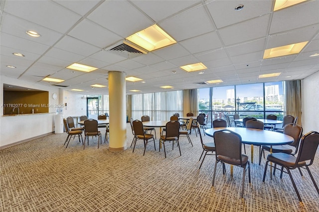 dining area with carpet flooring, visible vents, and a wealth of natural light