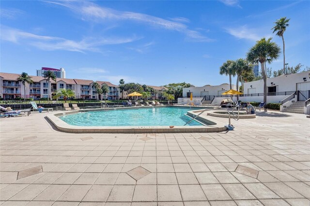 300 Three Islands Blvd Unit 518, Hallandale Beach, FL 33009 - community pool with a gazebo, a patio, and a residential view
