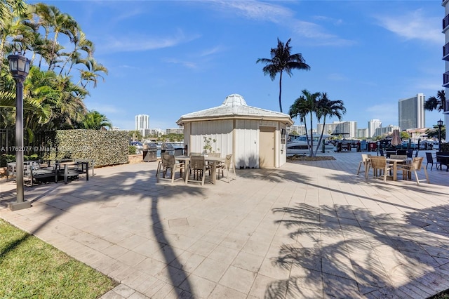 view of patio / terrace featuring a city view and outdoor dining area