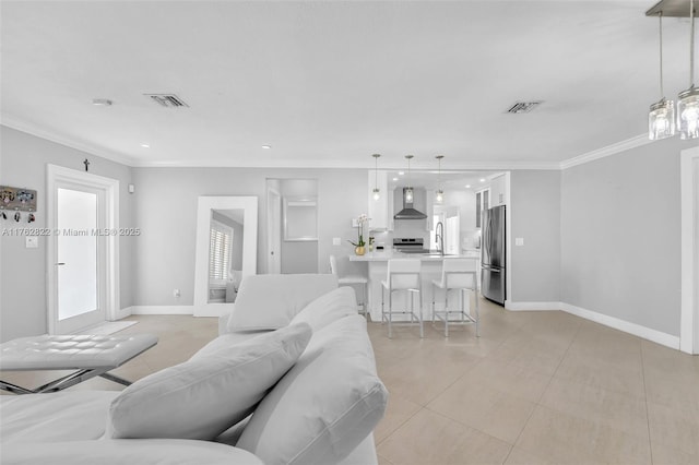 living area with crown molding, light tile patterned floors, baseboards, and visible vents