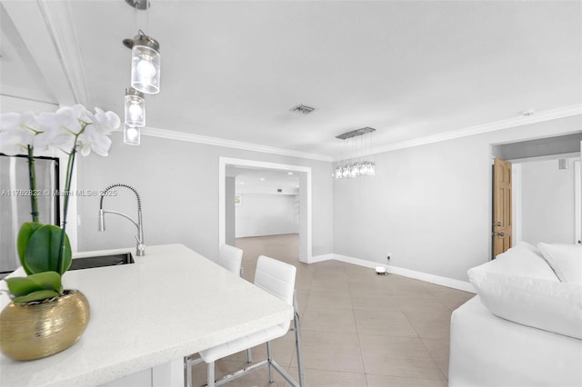 dining space with tile patterned floors, visible vents, baseboards, and ornamental molding