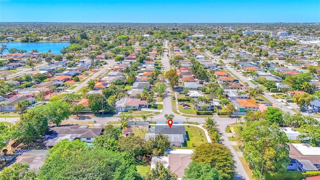 bird's eye view featuring a residential view and a water view