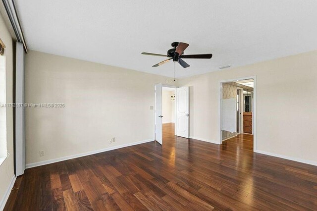 unfurnished bedroom with ceiling fan, baseboards, and wood finished floors