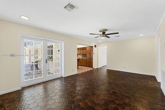 unfurnished living room featuring visible vents, french doors, baseboards, and ceiling fan