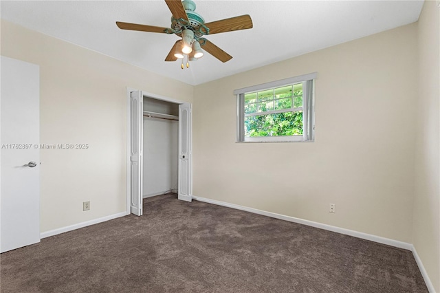 unfurnished bedroom with a closet, baseboards, carpet floors, and ceiling fan