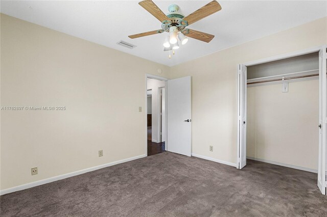 unfurnished bedroom with carpet, visible vents, a closet, and baseboards