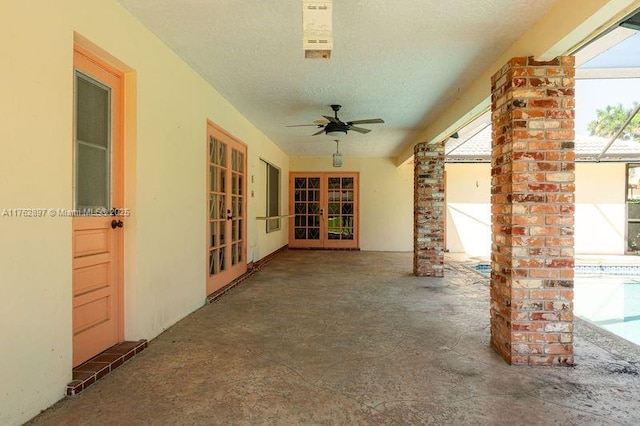 view of patio featuring french doors and a ceiling fan