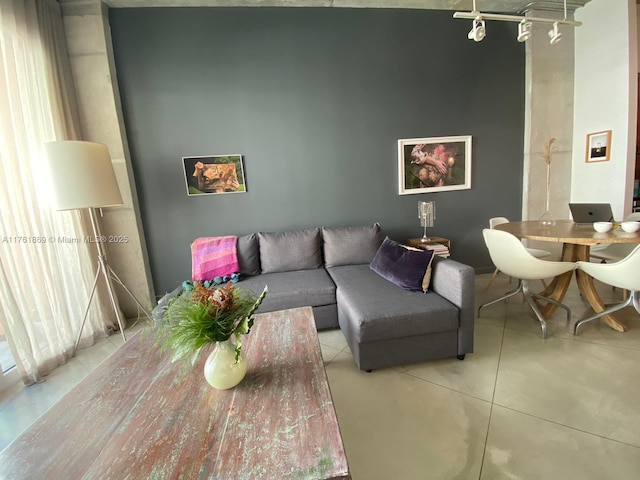 living area with concrete flooring