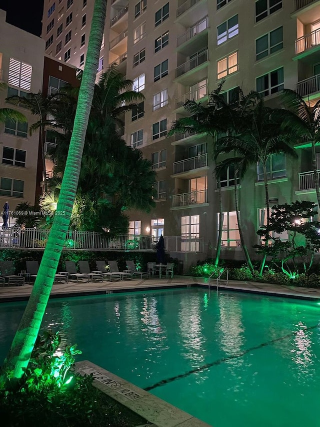 view of swimming pool with fence