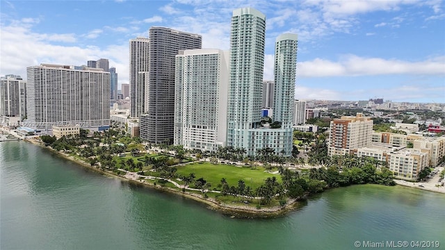 exterior space featuring a view of city and a water view