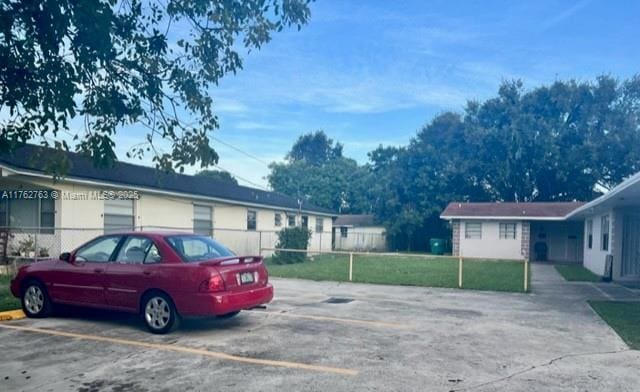 uncovered parking lot with fence