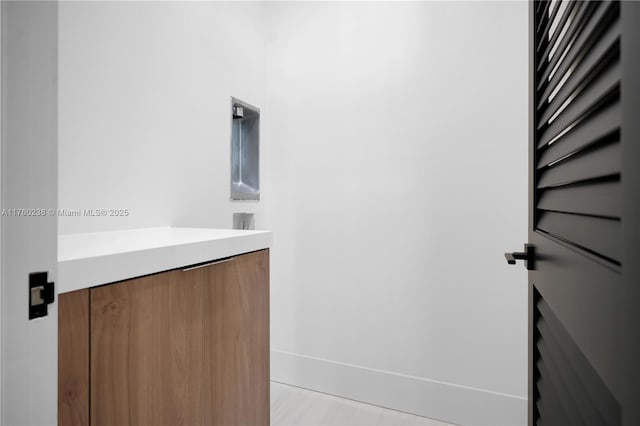 bathroom featuring vanity and baseboards