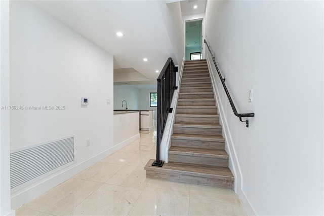 stairs featuring recessed lighting, visible vents, baseboards, and tile patterned floors