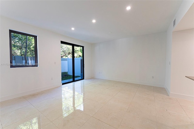 unfurnished room featuring light tile patterned floors, visible vents, recessed lighting, and baseboards