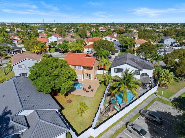 birds eye view of property with a residential view