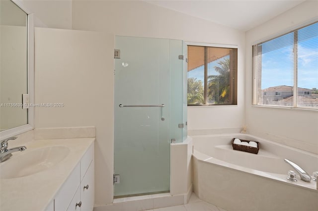 bathroom featuring lofted ceiling, vanity, a bath, and a shower stall