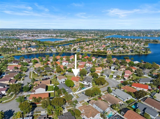 birds eye view of property with a residential view and a water view