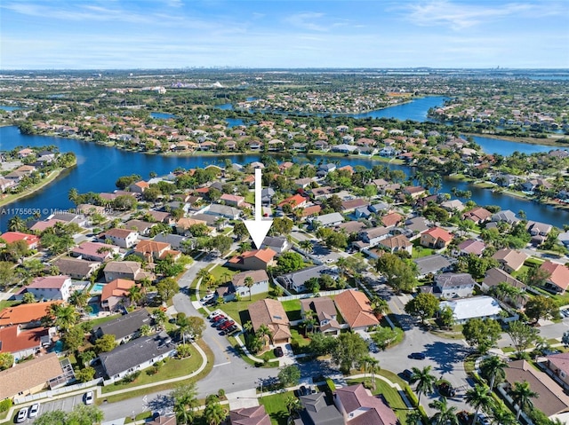 aerial view with a residential view and a water view