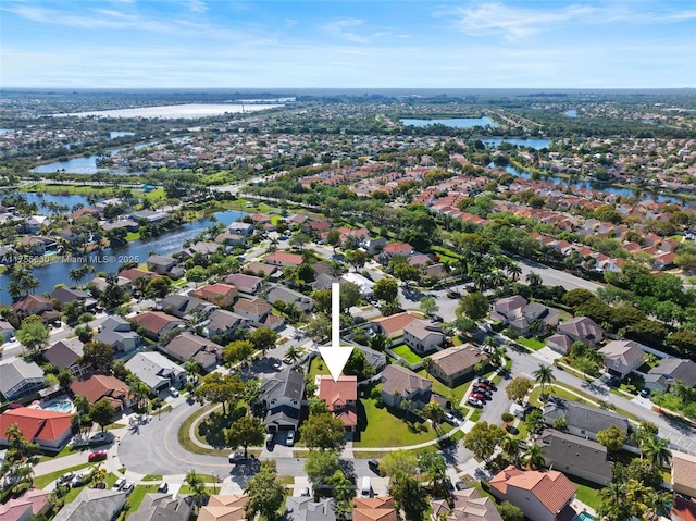 aerial view with a water view and a residential view