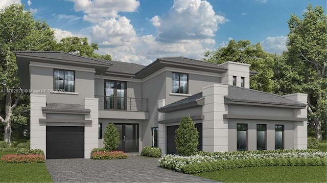 view of front of house featuring a balcony, decorative driveway, a garage, and stucco siding