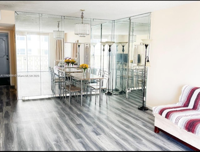 dining room with baseboards and wood finished floors