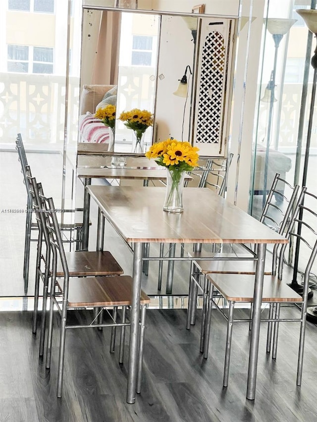 dining area with wood finished floors