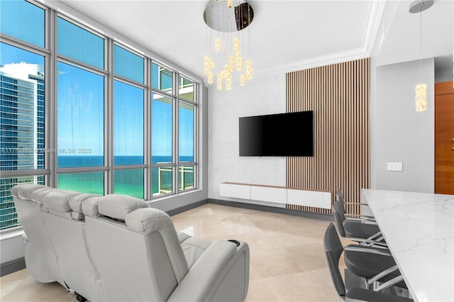 3535 S Ocean Dr Unit 2606, Hollywood, FL 33019 - living area featuring plenty of natural light, a chandelier, and ornamental molding