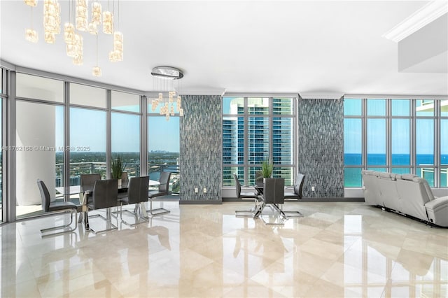 3535 S Ocean Dr Unit 2606, Hollywood, FL 33019 - dining space with a chandelier, a wall of windows, and plenty of natural light