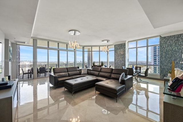 living area with a wall of windows, plenty of natural light, and a chandelier