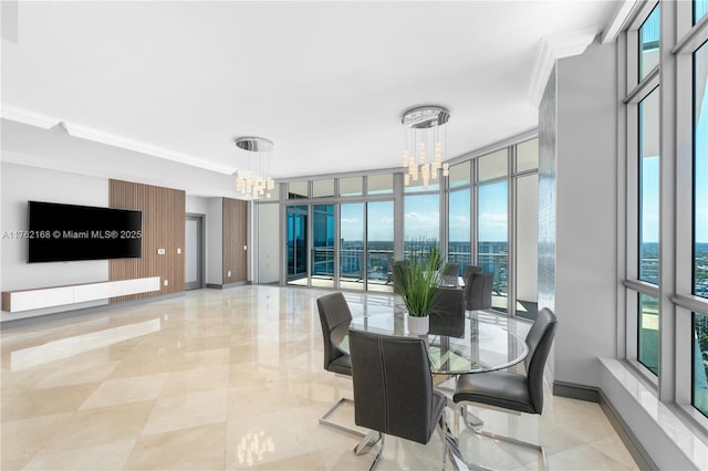 3535 S Ocean Dr Unit 2606, Hollywood, FL 33019 - dining room with a chandelier, ornamental molding, floor to ceiling windows, and baseboards