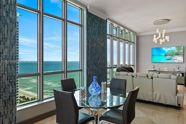 dining space with a wealth of natural light, an inviting chandelier, and crown molding