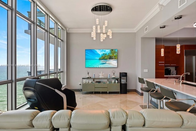 living area with visible vents, a water view, and ornamental molding