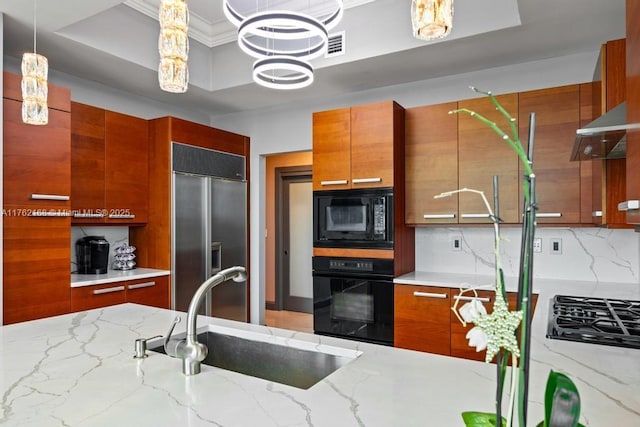 kitchen with brown cabinets, black appliances, modern cabinets, and a sink