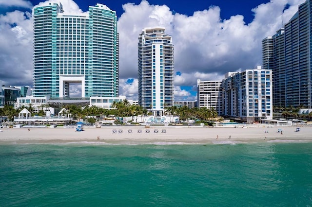 view of water feature with a view of city and a view of the beach