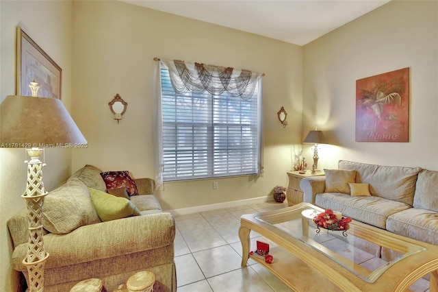 tiled living area featuring baseboards