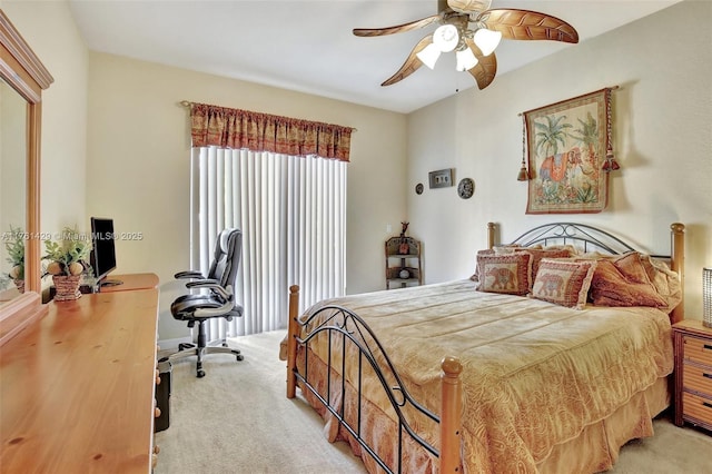 bedroom featuring light colored carpet and a ceiling fan