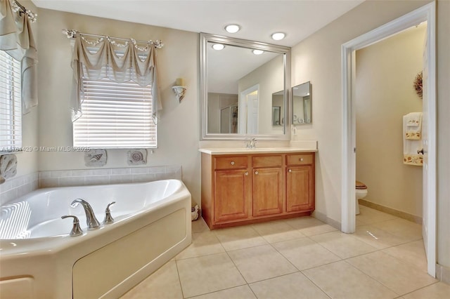 full bath featuring a bath, tile patterned flooring, toilet, and vanity