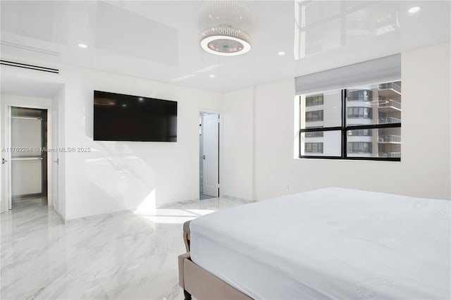 bedroom featuring recessed lighting and marble finish floor