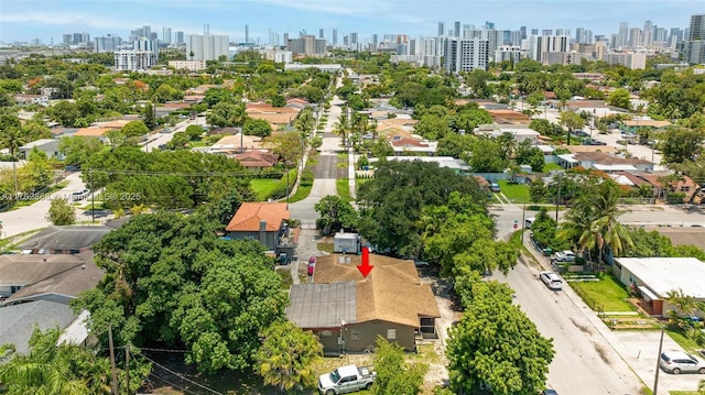 birds eye view of property featuring a city view