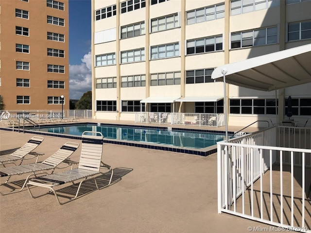 community pool featuring fence