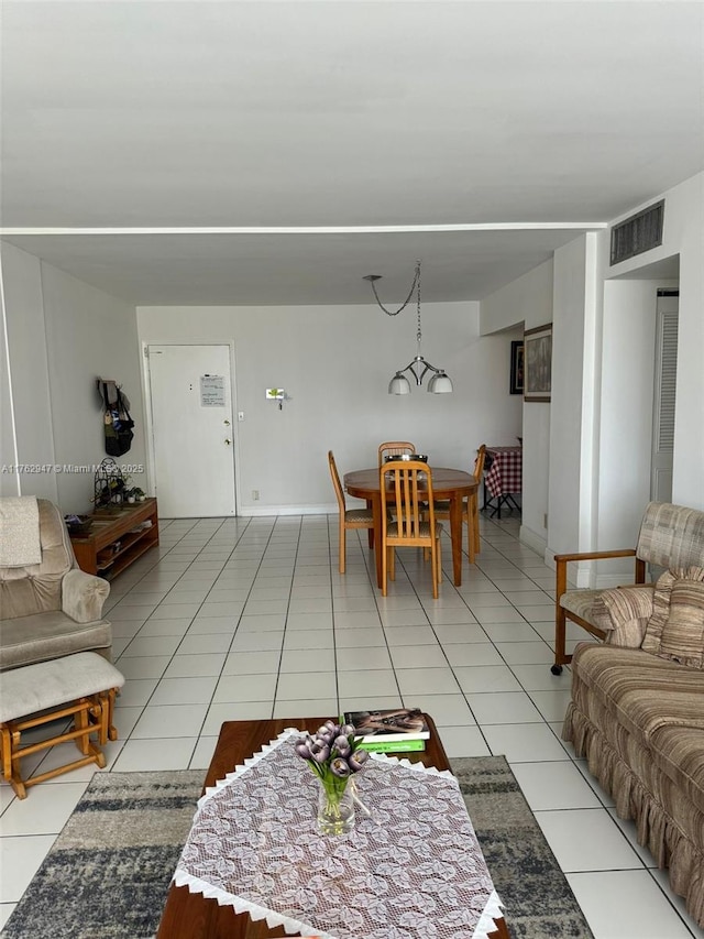 living area with light tile patterned floors and visible vents