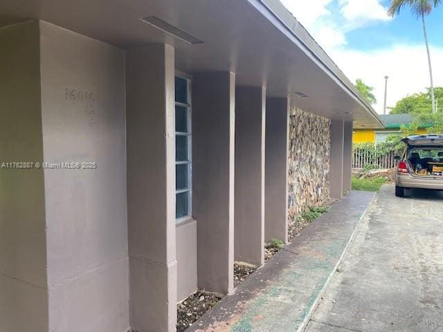 view of side of home featuring stucco siding