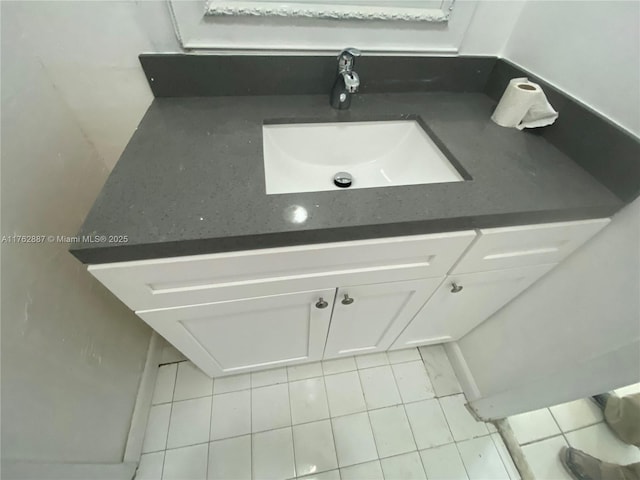 bathroom with tile patterned floors and a sink