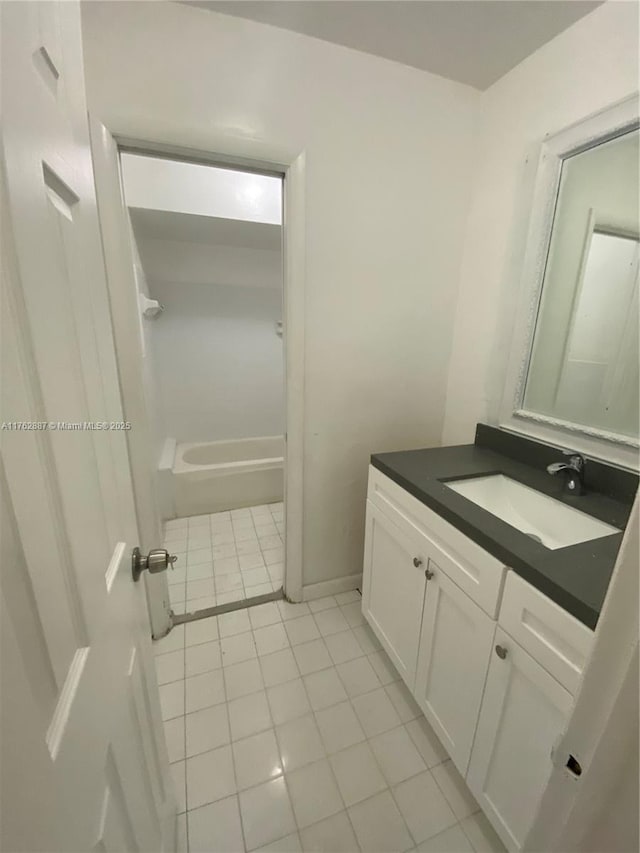 full bath with vanity and tile patterned flooring