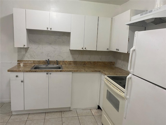 kitchen featuring under cabinet range hood, a sink, backsplash, white cabinetry, and white appliances