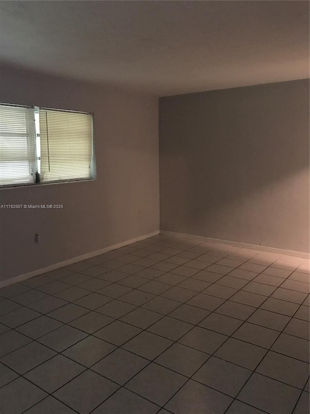 empty room with baseboards