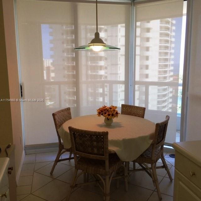 dining room with light tile patterned flooring