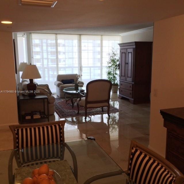 living room with ornamental molding