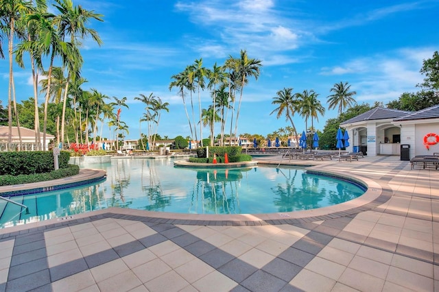 community pool with a patio area